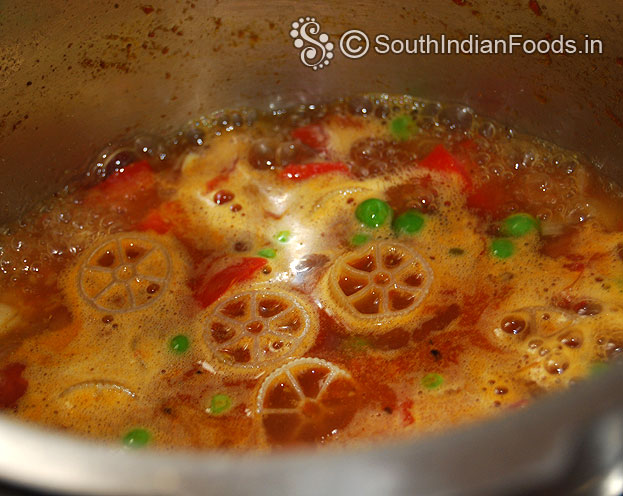 Heat pressure cooker with oil then add onion garlic