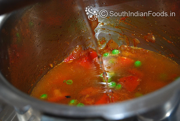 Heat pressure cooker with oil then add onion garlic