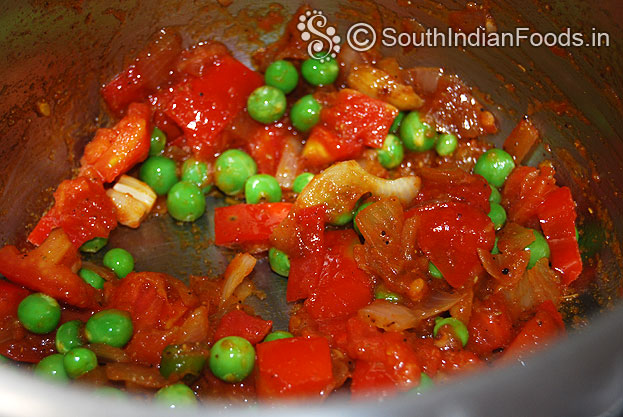 Heat pressure cooker with oil then add onion garlic