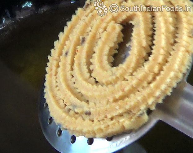 Heat oil, Put raw murukku