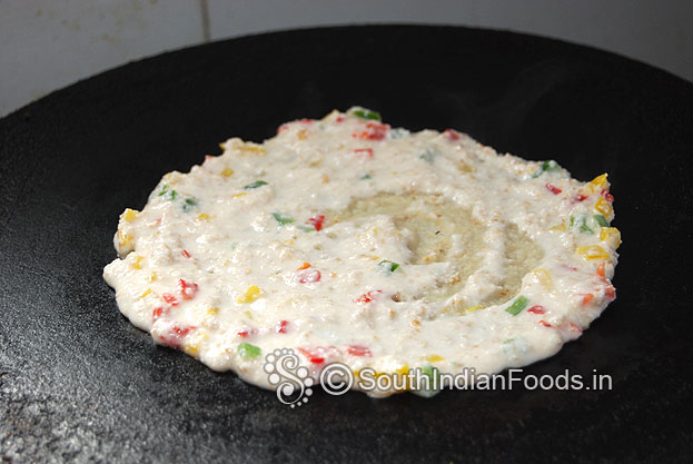 Heat iron dosa tawa, pour oats veg batter, spread immediately