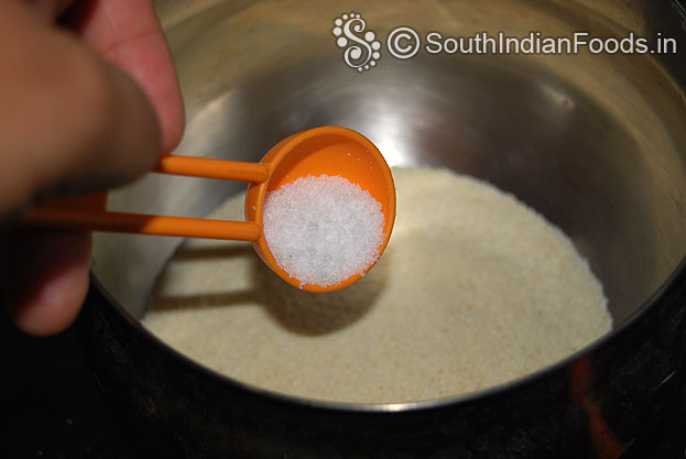 In a bowl add rava-semolina and salt mix well