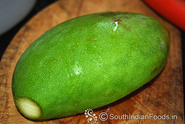 Wash and wipe out raw mango