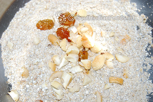 Take a bowl with kambu powder, add raisins & cashews