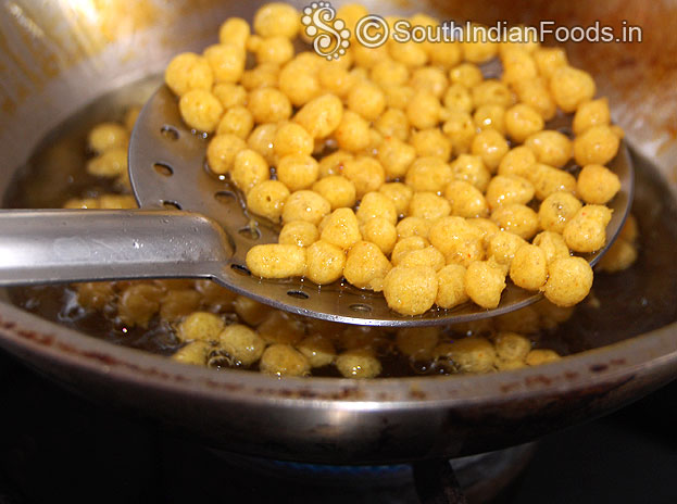 Boondi is ready, remove from oil, drain on absorbent paper