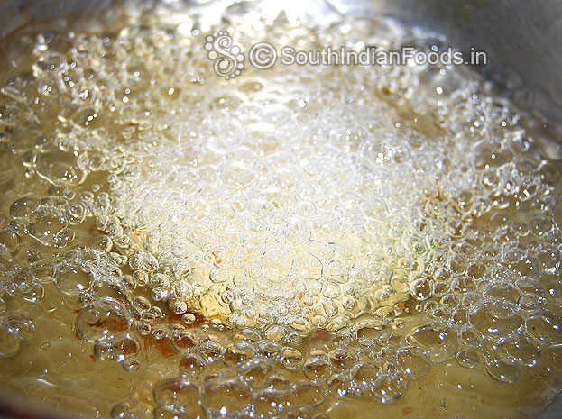 Heat oil in pan then put shaped vada