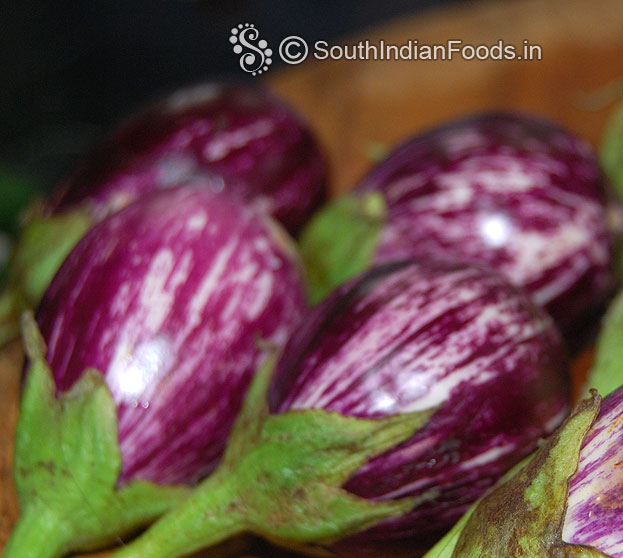 Wash and cut brinjal
