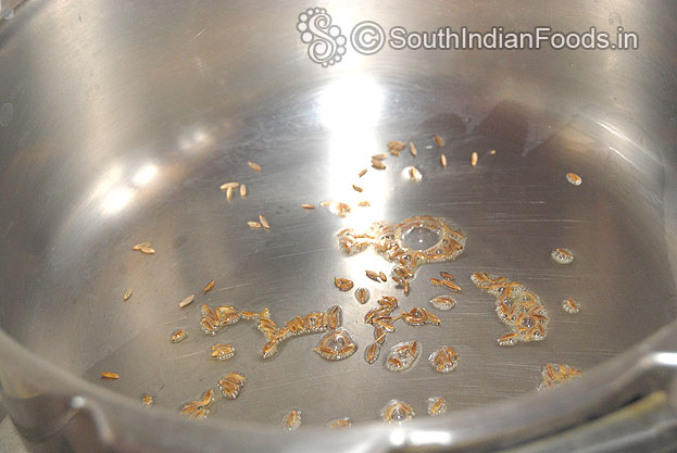 Heat pressure cooker, add ghee, oil, cumin seeds