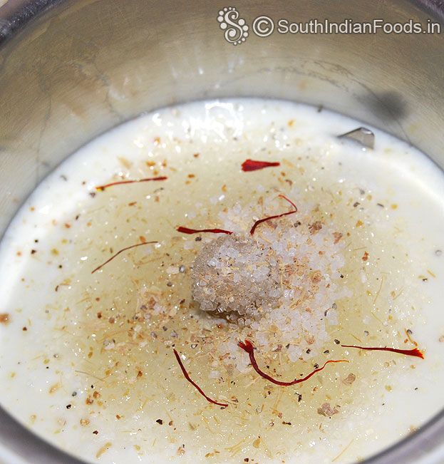 Add curd, sugar, saffron, chilled water, cardamom, blend well