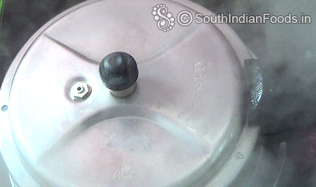 Cover lid & cook for 3 to 4 whistles