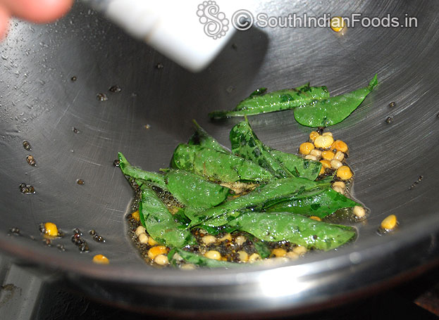 Heat sesame oil, add mustard, urad dal, bengal gram, curry leaves, asafetida fry till light brown