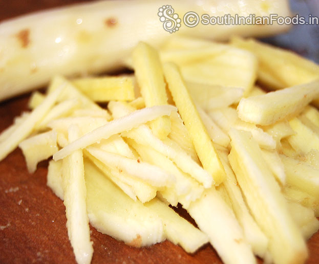 Grate raw mango mangai