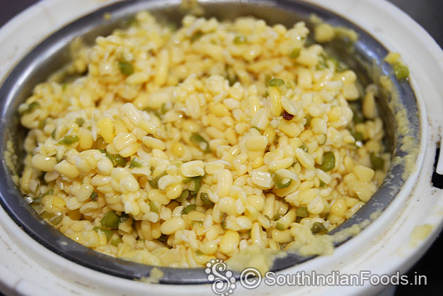 Put soaked moong dal in a mixer jar, coarsely or finely grind