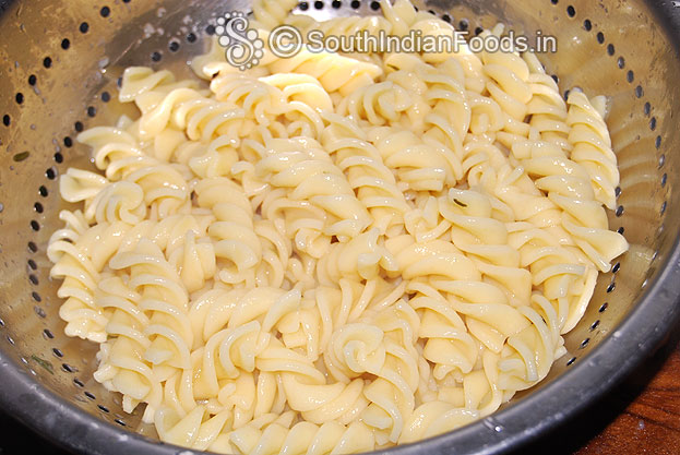 Boil fusilli pasta drain water