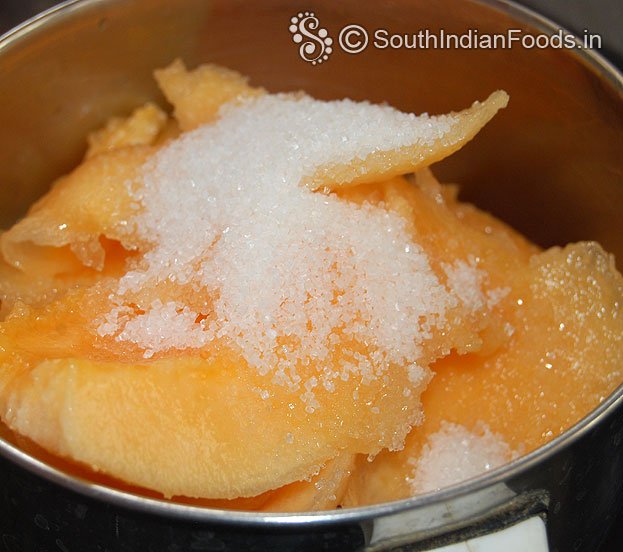 In a mixie jar / blender add muskmelon, sugar, water