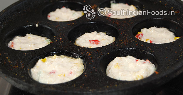 Heat iron paniyaram tawa, pour batter and oil, cover it, cook till crisp and golden brown both sides