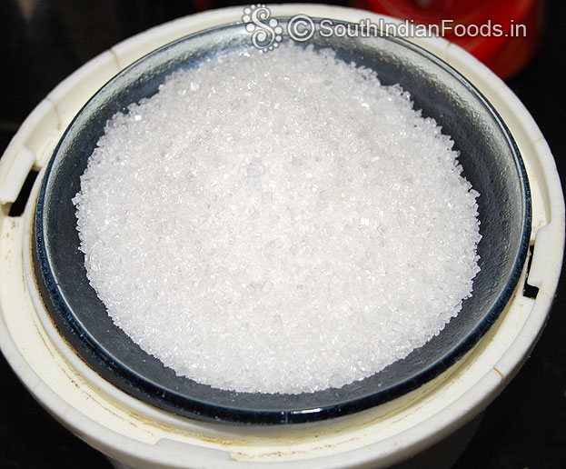 Add sugar in a mixie jar