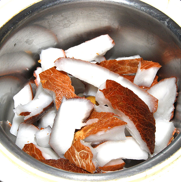 In a mixie jar, add coconut