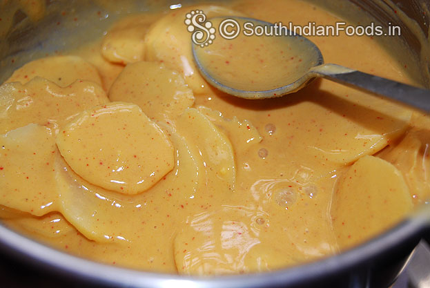 Dip all potato slices & mix well