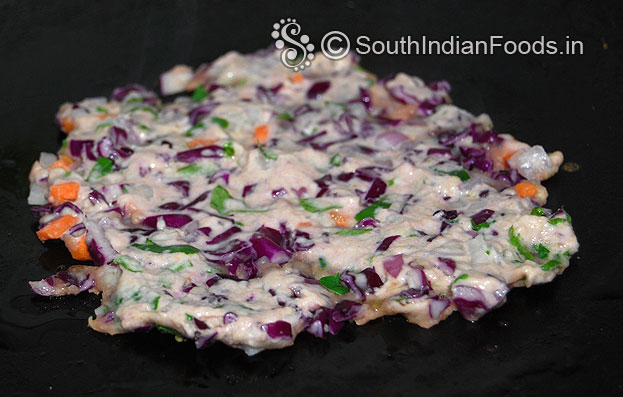 Heat iron dosa pan, place one handful of mixture, spread immediately, pour oil