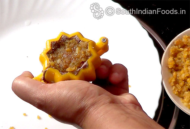 Place chana dal, coconut, jaggery filling