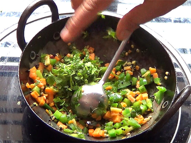 In a bowl add white rava & salt