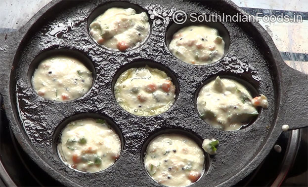 In a bowl add white rava & salt