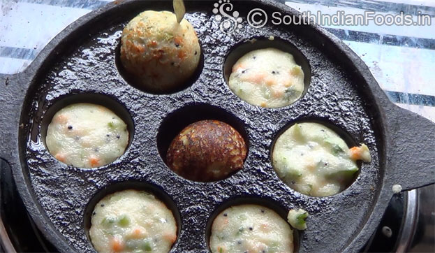 In a bowl add white rava & salt