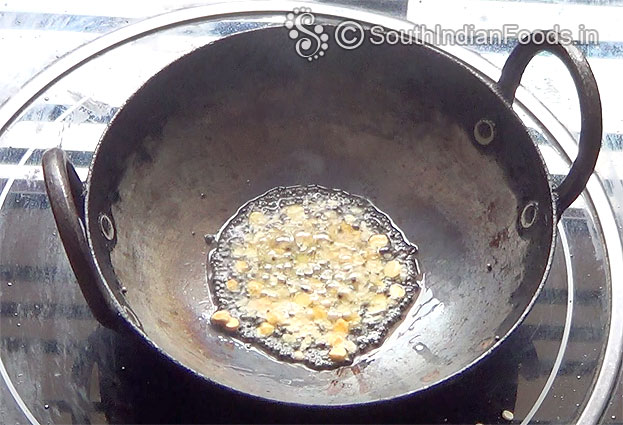 In a bowl add white rava & salt