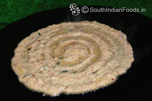 Heat iron dosa tawa, Pour samai adai batter, spread, then pour 1 tbsp of oil cook both sides