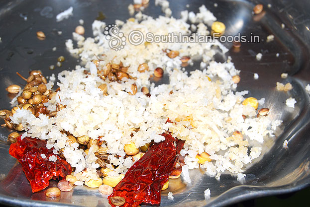 Heat 1 tbsp of oil in a pan then roast dry red chilli, coriander, cumin seeds, coconut, bengal gram & urad dal then grind with 1/2 cup of water
