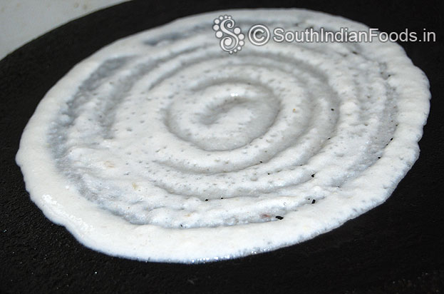 Heat iron dosa tawa pour batter spread immediately