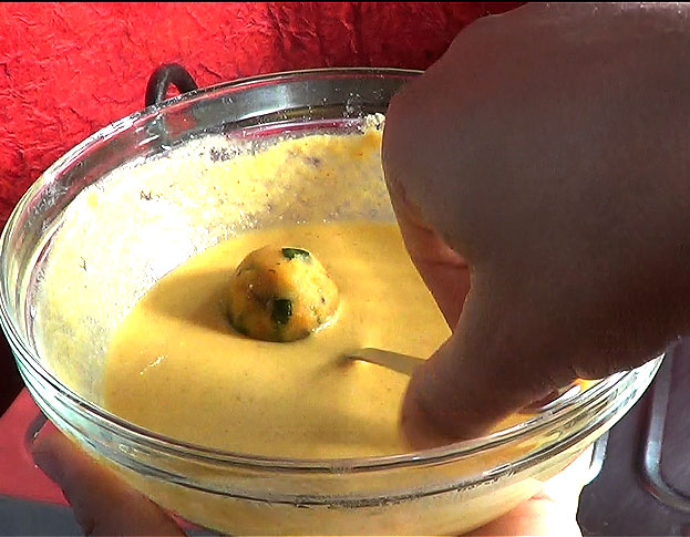 Dip potato into the batter