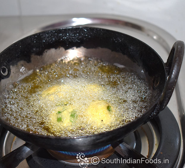 Heat oil, add sooji balls