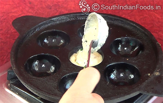 Heat paniyaram tawa, pour 1 tbsp oil & batter