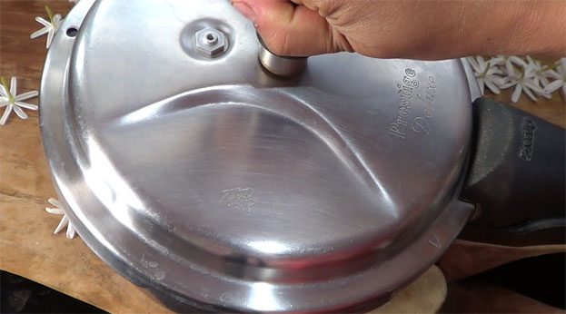 Cover lid, cook for 3 whistles