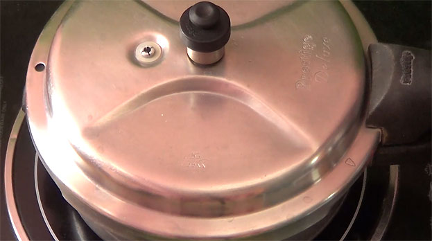 Cover lid, cook for 4 whistles