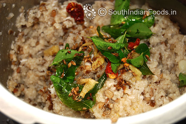 Add seasoned ingredients to varagu urad dal rice mix well