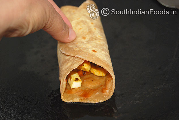 Heat iron tawa, place veg kathi roll, cook tilll crisp both sides
