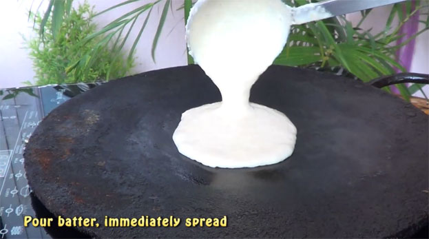 Heat iron dosa tawa, pour batter