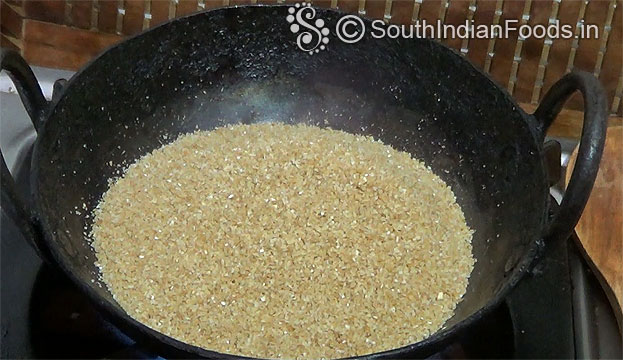 Heat pan, add wheat rava