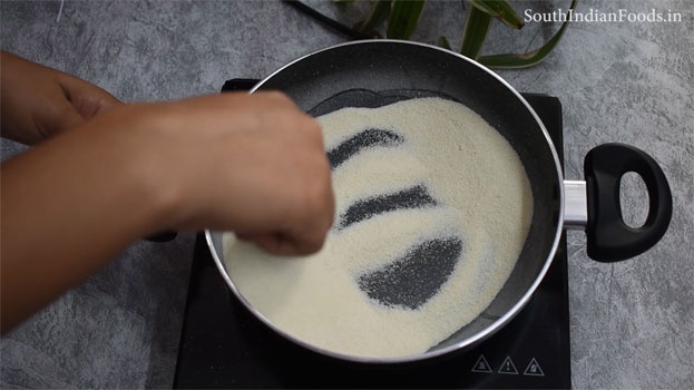 In a bowl add white rava & salt