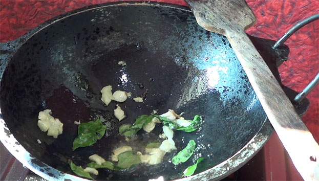 Heat oil, add mustard, garlic & curry leaves