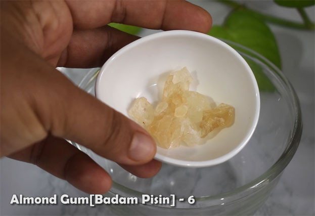 In a bowl add curd, cardamom, sugar