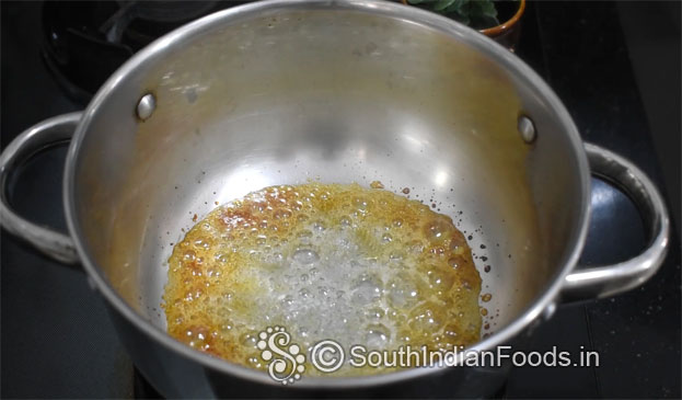 In a bowl add curd, cardamom, sugar