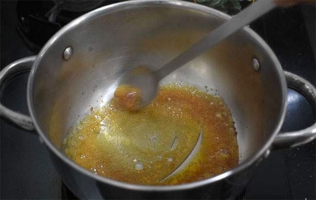 In a bowl add curd, cardamom, sugar