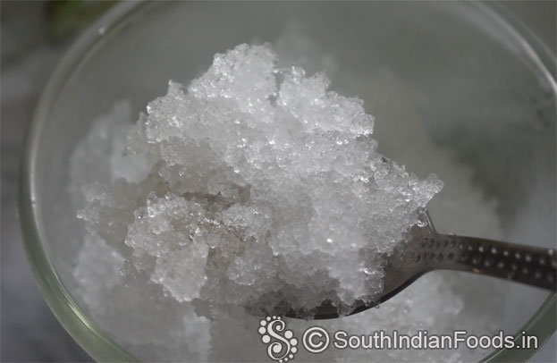 In a bowl add curd, cardamom, sugar