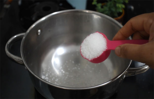 In a bowl add curd, cardamom, sugar