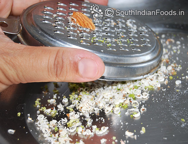 Grate almonds and pistachios