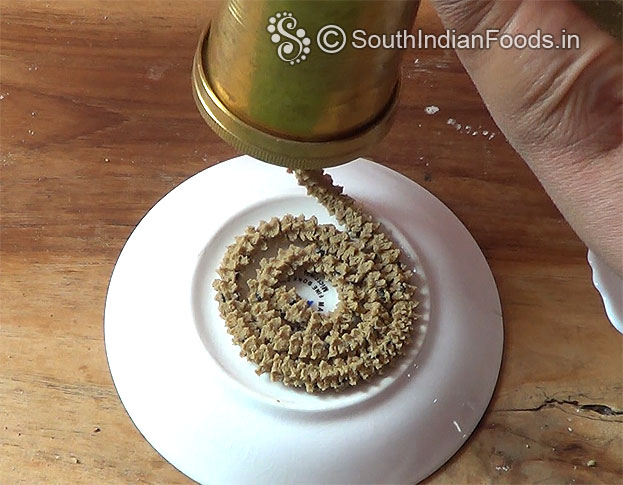 Take star murkku mold & fill the handful of dough